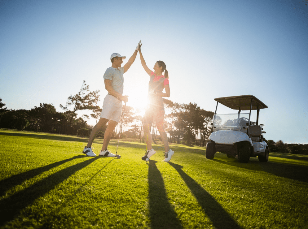happy-golf-player-couple-giving-high-five 1